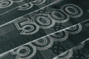 Russian banknotes 5000 rubles close-up. Fragment of a bill with focus on the denomination figure. Dark money inverted background. Black and gray wallpaper. Banks economy and currency in Russia. Macro