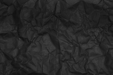 black crumpled paper texture as background