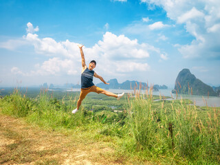 A tourist is very happy at Samet Nangche viewpoint, Phang nga province, in Thailand.