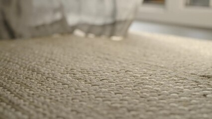 Slow motion handheld shot of jute rug closeup - Powered by Adobe