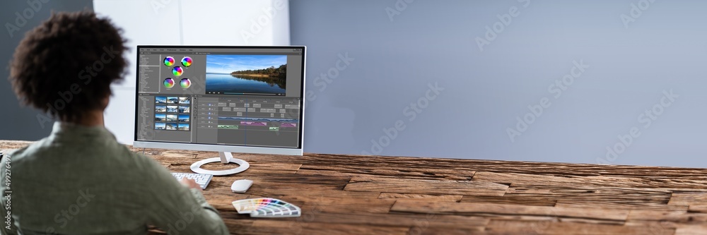 Poster Editor Editing Video On Computer