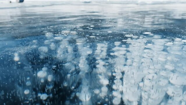 Beautiful transparent blue ice and frozen methane bubbles on Baikal Lake background texture, 4k