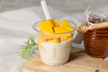 Bowl of fresh yogurt with fruit served for good health.