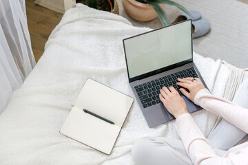 Woman using laptop with mock up, copy space display
