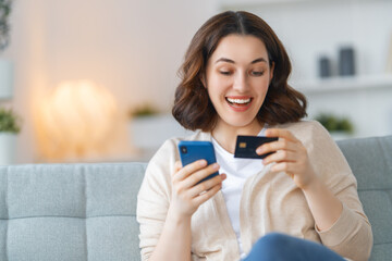 Fototapeta premium Woman is doing online purchases