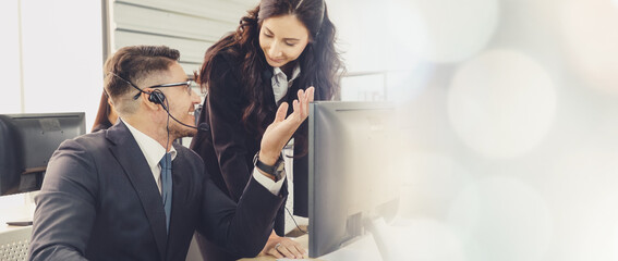 Business people wearing headset working in office to support remote customer or colleague. Call center, telemarketing, customer support agent provide service in broaden view .