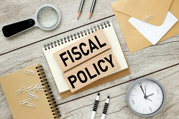 Fiscal policy Flat lay style. text on wooden blocks.