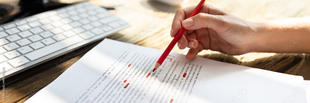 Poster person marking error with red marker