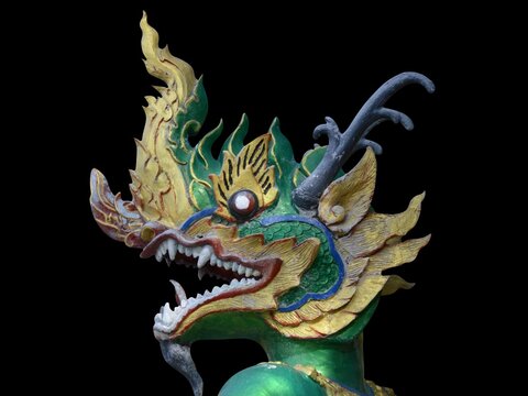 dragon statue on black background