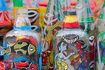 Fototapeta premium Bright colorful terracotta bottles, works of handicraft, on display during Handicraft Fair in Kolkata - the biggest handicrafts fair in Asia.