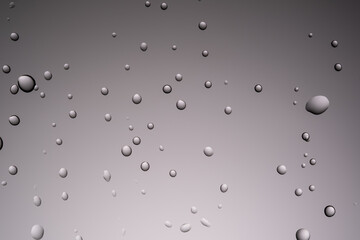 Drops of water on a transparent gray background.