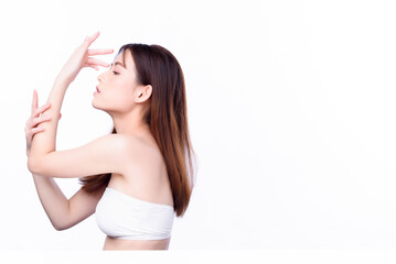 Portrait of beautiful charming young Asian woman posing facial and sitting with white table, beauty of female face with skincare on white background, healthcare and skin care concept.