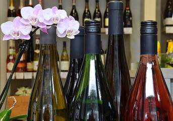 Wine shop with a wide selection of goods. Lots of wine bottles in the wine shop. Large selection of wine.