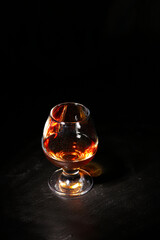 whiskey glass on a black background