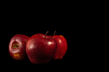 Three red apples