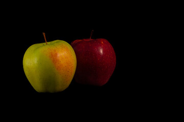 one yellow and one red apple