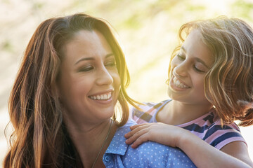 To the moon and back remember. Shot of a mother giving her daughter a piggyback ride.