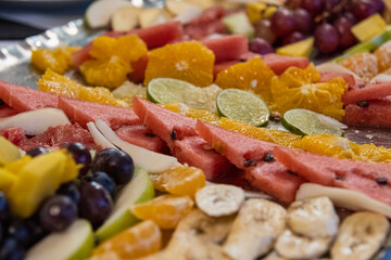 fresh fruit table cut and arranged with decorations