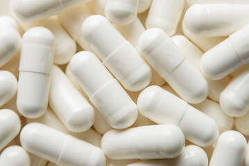 Medicine capsules very close-up. Photo of medical preparations with selective focus.