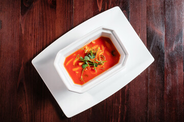 Squid in pilati sauce. Seafood in tomato sauce top view.