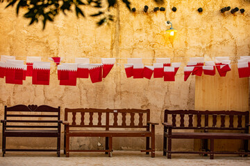 Obraz na płótnie Canvas Wall with flags of Qatar