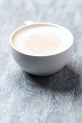 Coffee with milk on wooden background. Close up. Copy space.	