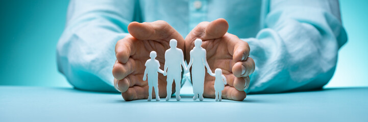 Businessperson's Hand Protecting Family Figure Cut