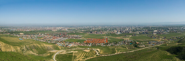 Fototapeta na wymiar Aerial panoramic view of Bishkek city from the mountains