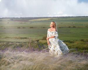 A girl in a summer dress in a meadow. Ukraine
Beautiful girl. Amazing summer nature around. The concept of harmony and wanderlust. Rustic natural style. A breath of wind for a dynamic photo.