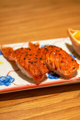 A sweet and delicious Japanese dish, grilled salmon sushi