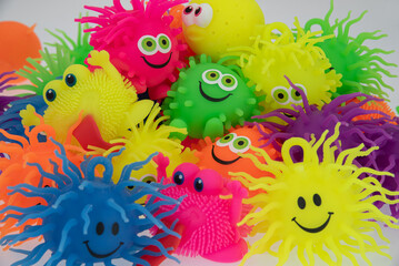 Fototapeta na wymiar multi color pufferball moster smile plastic rubber 