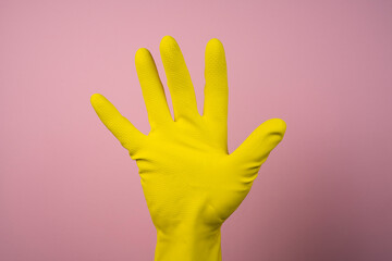 a yellow rubber cleaning glove