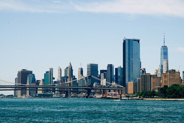 Fototapeta na wymiar Manhattan New York City skyline with bridge and water