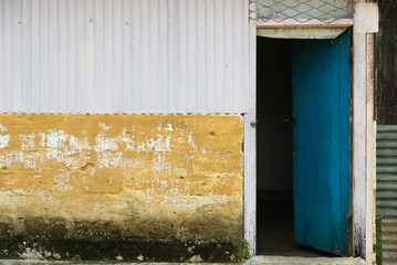 Blue door of a poor home, rural Sri Lanka