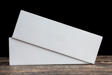 a white rectangular box on a black board
