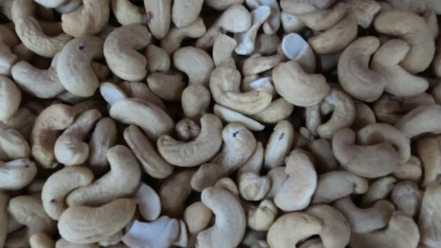 Heap of Cashew Nuts or Kaju Badam .Smooth Movement of a pile of cashew nuts, without shells