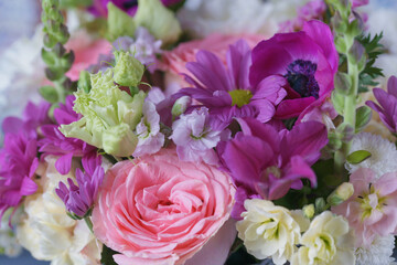 Decorative bouquet of many different small and large flowers