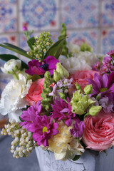 Decorative bouquet of many different small and large flowers