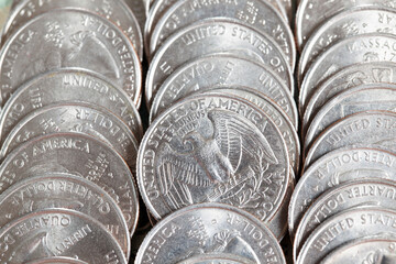 bunch of American coins of 25 cents, old dirty coins