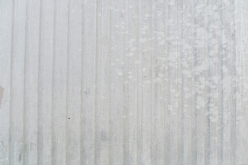 Background and textured of old white paint on the plastic surface is a straight track.