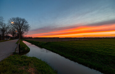 Fototapeta na wymiar Perspective of a waterway during sunset