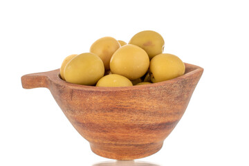 Several green pitted olives in a wooden cup, close-up, isolated on white.