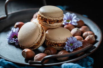Homemade and sweet nuts macaroons in small wooden box.
