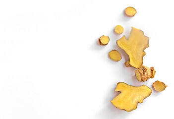 Top view of Sliced ginger on white background. Ginger is one of the ingredients in Thai food and...
