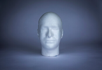 White styrofoam male head isolated on background