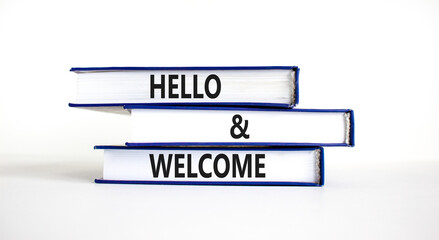 Hello and welcome symbol. Concept words Hello and welcome on books. Beautiful white table white background. Business hello and welcome concept. Copy space. © Dzmitry