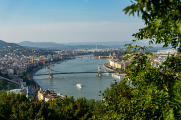 Fototapeta na wymiar Selective focus on the view of the Danube and Gellert Hill Szechenyi Chain Bridge and the Hungarian Parliament in Budapest
