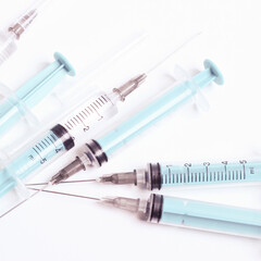 Medical syringe on a white background. A syringe for injection. The concept of health and beauty