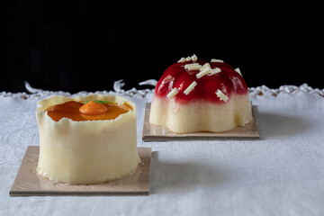 Two sweet pastries with fruit and jellies.