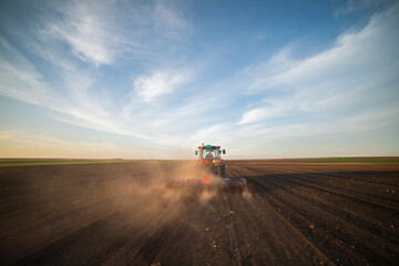 Fototapeta premium Tractor working in the field